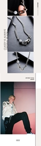 Detail of silver Cuban chain necklace featuring a grey marble stone bead accent