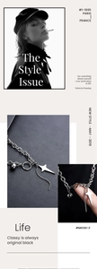 Detail of silver chain necklace with star pendant and metal ball on leather background
