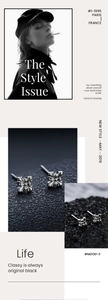 Gros plan de boucles d'oreilles croix en argent sur roche noire avec mise en page mode