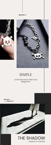 Macro detail of silver skull pendant necklace with gothic punk chain link design