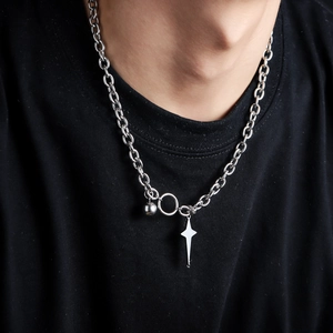 Unisex silver star and ball pendant necklace with thick link chain on black T-shirt