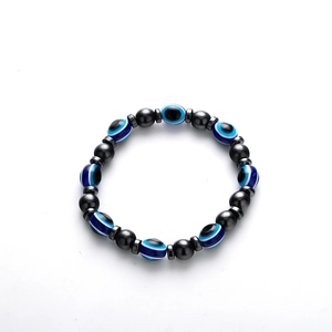 Men's retro hematite bead bracelet featuring blue evil eye charms on a white background