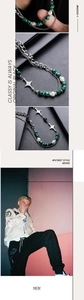 Detail of cross star necklace with green malachite beads and white pearls for men and women