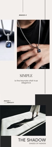 Detail of snake chain necklace with Lucky engraved bail and blue rectangle gemstone