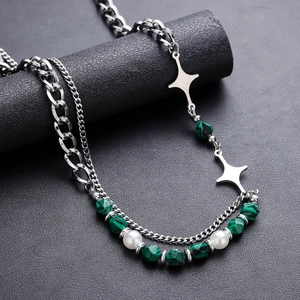 Cross star necklace with green malachite beads and silver chain on display