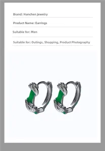 Detailed view of silver men's hoop earrings featuring green jade inlays and dragon carving