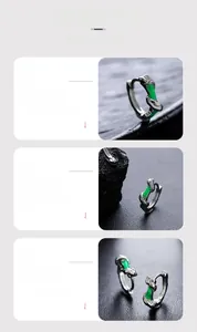 Detail view of silver earrings with green enamel and skin-friendly polished finish