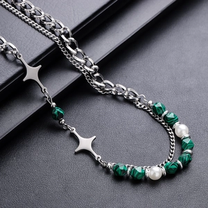 Double-layer necklace with green beads, pearls, and silver cross star pendants on black leather
