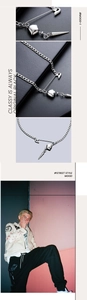 Détail du collier trombone avec pendentifs cœur et pointe pour un style urbain