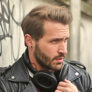 Minimalist black magnetic ear clip with crystal cluster finish on a male model