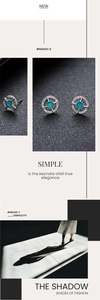Detailed macro view of silver compass stud earrings with turquoise stone inlay for men