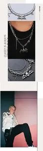 Détail d'un collier double épaisseur en acier inoxydable punk avec pendentif chauve-souris