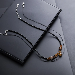 Minimalist beaded necklace with irregular tiger eye stone fragments and silver clasp