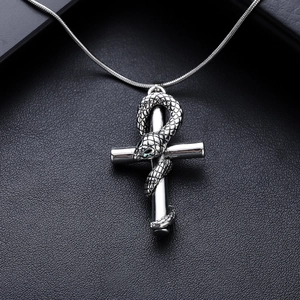 Gothic snake cross necklace in vintage stainless steel with green eye accents