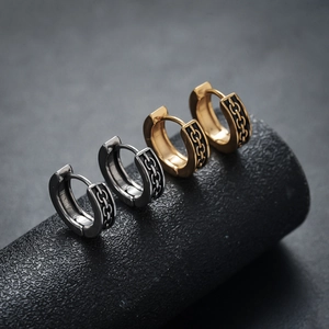 Classic chain pattern hoop earrings in silver and gold finishes with black enamel details