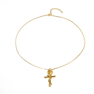 Golden cross necklace with wrapped snake pendant and green zircon eye on snake bone chain