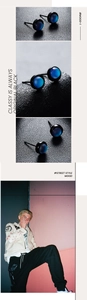 Macro detail of round cat eye stone stud earrings with black metal base for men