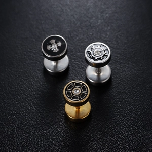 Industrial punk disc stud earrings with zirconia accents on a black leather surface