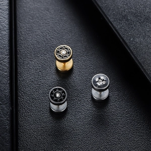 Three vintage round stud earrings with geometric patterns and central cubic zirconia stones