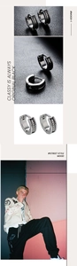 Macro view of vintage style steel hoop earrings with black woven pattern and street fashion details