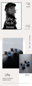 Detail of blue zircon stud earrings with screw-back sphere and halo setting