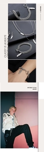 Detailed view of silver feather necklace and bracelet with OT buckle in street style