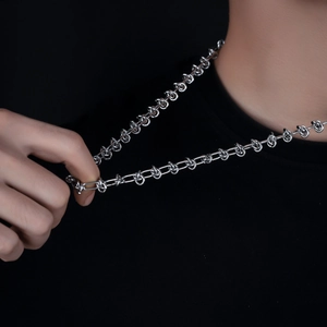 Polished silver knot necklace made of durable stainless steel for a minimalist industrial look