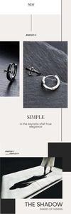 Détail de la boucle d'oreille croix minimaliste avec émail noir et finition métal poli