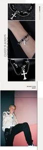 Détail du bracelet à perles avec pendentif croix et chaîne métallique multicouche