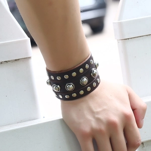 Punk vintage wide leather bracelet for men featuring multiple rows of metallic rivets