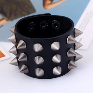 Punk leather bracelet with three rows of silver metal spikes and adjustable buckles