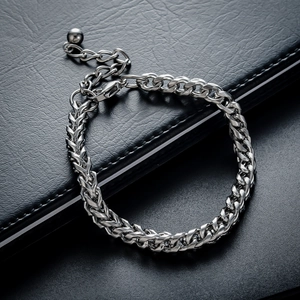 Detail of silver titanium steel curb chain bracelet with adjustable lobster clasp