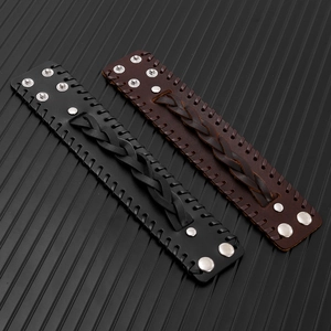 Detailed view of punk woven leather bracelets with silver rivets and snap button closure