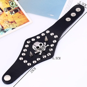 Men's punk leather bracelet featuring skull studs and silver rivets on a wide band