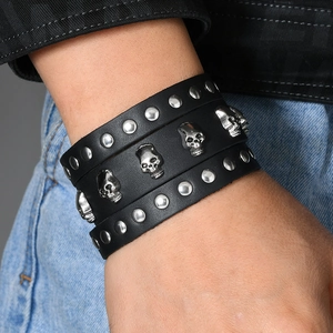 Punk vintage wide black leather bracelet for men featuring silver skulls and rivets