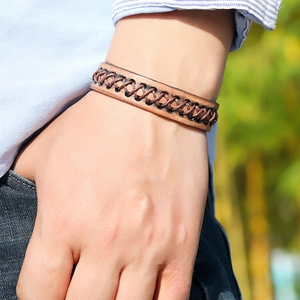 Vintage brown woven leather bracelet for men featuring a rustic punk and minimalist style