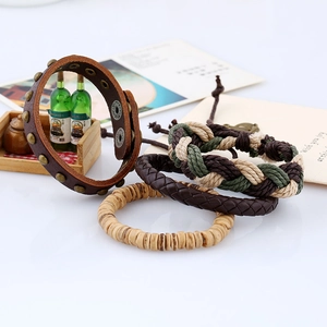 Close-up of four-piece retro woven leather bracelet set with wooden beads and studs