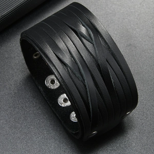 Detail of adjustable triple snap button closure on black braided leather punk bracelet