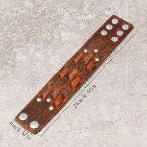 Vintage brown leather wristband with woven texture and metal snaps, size 24cm by 4cm