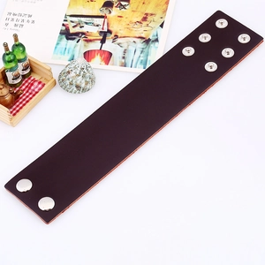 Punk vintage dark brown leather cuff bracelet with adjustable silver metal snaps on white base