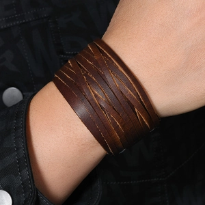 Mens vintage punk multilayer dark brown leather wrap bracelet on wrist with denim jacket
