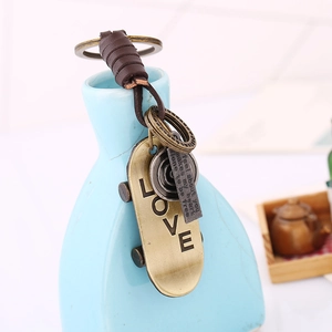 Retro woven leather keychain featuring a vintage bronze scooter pendant and LOVE engraving