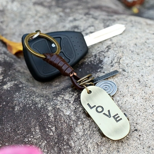 Retro braided leather keychain with brass LOVE tag and scooter charm for car accessories