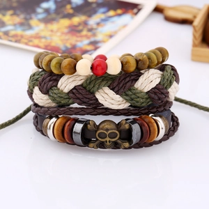 Set of 4 vintage leather bracelets featuring multi-layer weave with skull bead and wood accents