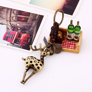 Porte-clés vintage en bronze avec cerf et sangle en cuir tressé pour sac à main
