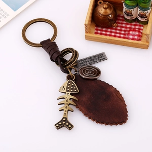 Handmade leather keychain with vintage bronze fishbone pendant and retro metal charms