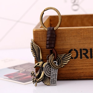 Vintage eagle pendant keychain with braided leather strap and engraved metal tags