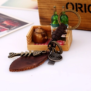 Vintage braided leather keychain with alloy fishbone and miniature green bottles