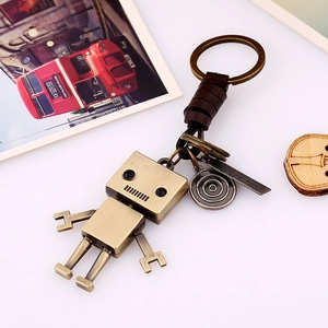 Vintage bronze robot keychain with brown leather braided rope and metal ring