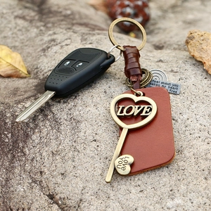 Vintage woven leather keychain with bronze heart pendant and love engraving on stone